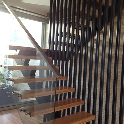 Internal stair with timber treads and steel balustrading